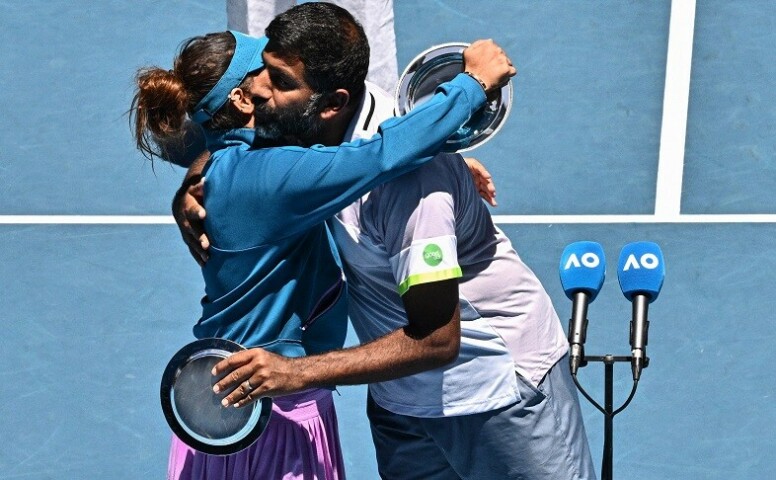 Sania Mirza (L) and Rohan Bopanna hug during the awards ceremony after their defeat against Brazil’s Luisa Stefani and Rafael Matos during the mixed doubles final on day twelve of the Australian Open tennis tournament in Melbourne on Friday. — AFP